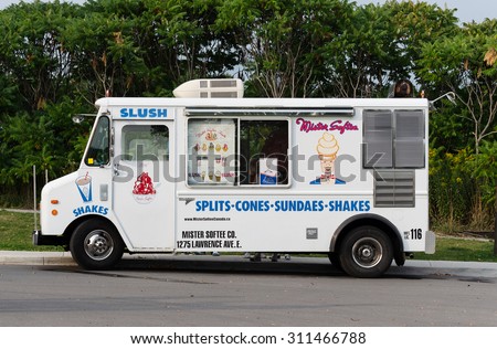 RICHMOND HILL - AUGUST 30, 2015: Old-fashioned ice cream truck parked at the Lake Wilcox park in Richmond Hill, Ontario on August 30, 2015