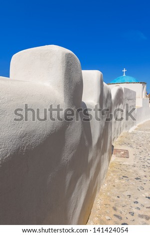 Greece Santorini island in Cyclades,  wide view of white washed walls by narrow streets