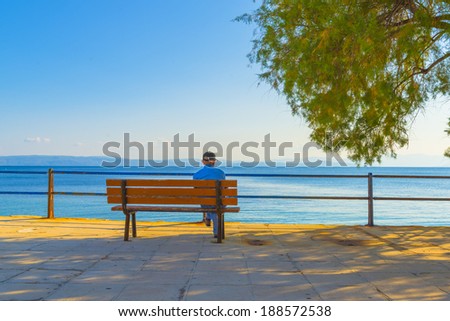 Lonely Old man staring the sea