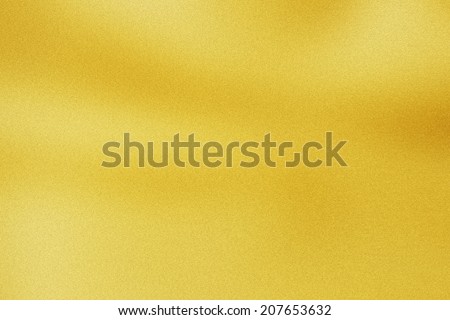 Abstract gold background luxury cloth, liquid wave or wavy folds of grunge silk texture satin, gold background may use for wedding background.