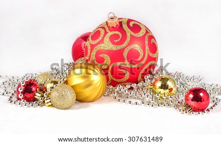 Golden, silver and red  Christmas decorations on a white background