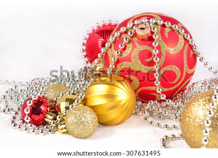 Golden, silver and red  Christmas decorations on a white background