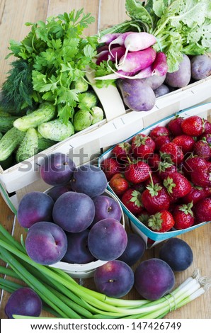 Assortment of fruits and vegetables in the baskets. Black Apricots - hybrid apricot and cherry-plum