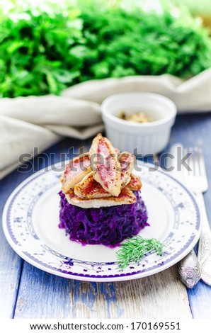 Fried red mullet with braised purple cabbage and fried onion
