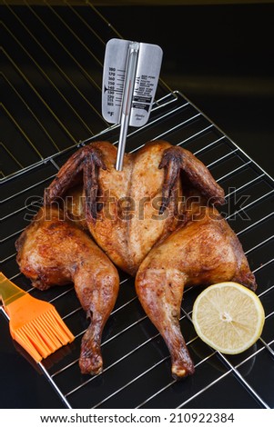 whole roasted chicken on an oven rack