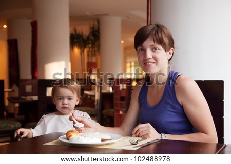 Family  having breakfast in hotel restaurant