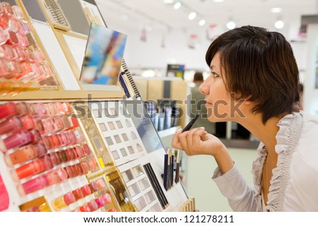 girl buying cosmetic at cosmetics  shop