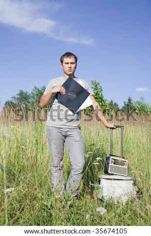 dj man with disk and radio at nature