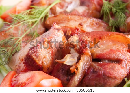 Stewed meat meat and tomatoes on Green leave