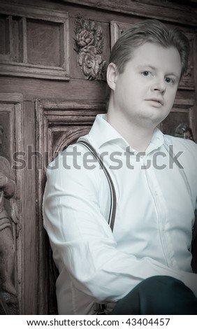 Retro portrait of man against vintage furniture