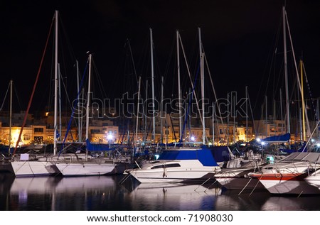Many yachts lying at Malta harbour in  night, Valletta