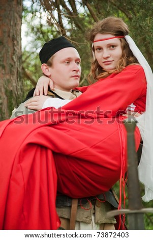 Young medieval couple,  soldier in armour  and maid