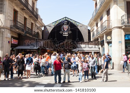 BARCELONA, SPAIN - JUNE 1: Main gate at La Boqueria market in June 1, 2013 in Barcelona, Spain.  Market has been known since 1217. Now - one of the city\'s foremost tourist landmarks