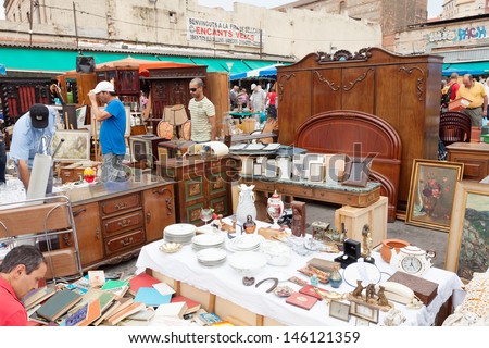 BARCELONA, SPAIN - JUNE 26: Encants Vells flea market at Glories Catalanes square in June 26, 2013 in Barcelona, Spain. This is one of oldest markets in Europe, has been known since the 14th century