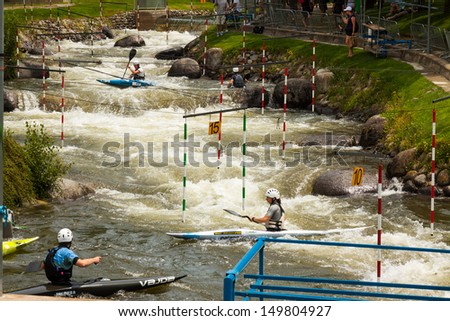 LA SEU D'URGELL, SPAIN - JULY 3: Unidentified athletes trying to route. ICF Canoe Slalom World Cup 3 in July 3, 2013 in La Seu d'Urgell, Spain. Parc Olimpic del Segre, built in 1992 for Olympic Games