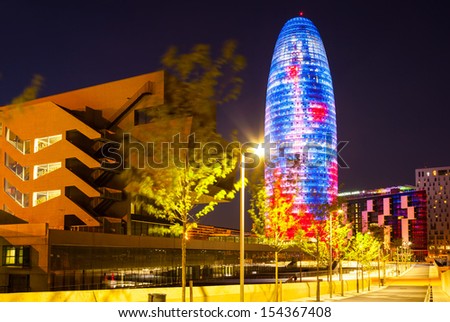 BARCELONA, SPAIN - APRIL 12: Night view of Torre agbar in April 12, 2013 in Barcelona, Spain. 38 storey skyscraper, built in 2005 by Jean Nouvel. Now one of the symbols of city is owned by Grupo Agbar