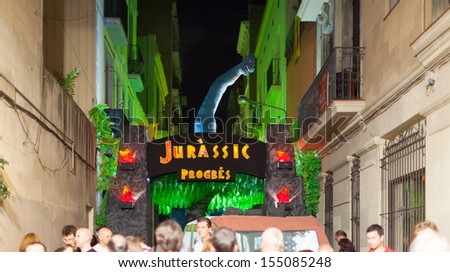 BARCELONA, SPAIN - AUGUST 15: Gracia Festival in night in August 15, 2013 in Barcelona, Spain. Each street is decorated with hand residents of the street