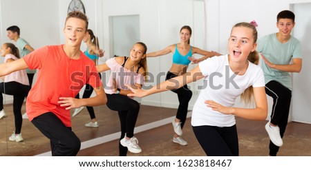 Similar – Image, Stock Photo Dance training of a woman in dance studio | reflection in background in black and white