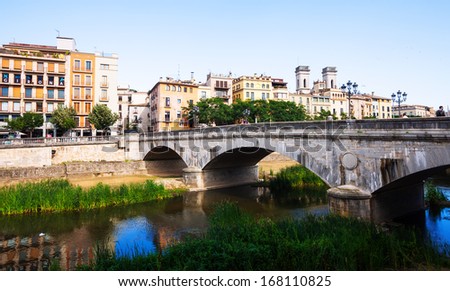 GIRONA, SPAIN - JULY 1: Old bridge over the river Onyar on July 1, 2013 in Girona, Spain. One of the oldest cities in Europe with well-preserved medieval buildings.  Population: 96,722  (2011 Census)