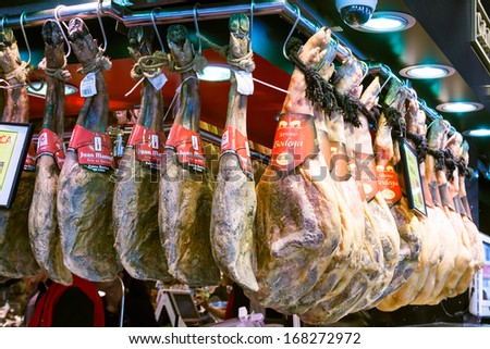BARCELONA, SPAIN - MARCH 28: Serrano and iberico hamon at La Boqueria market in March 28, 2013 in Barcelona, Spain. Market has been known since 1217. Now - one of city\'s foremost tourist landmarks