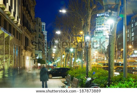BARCELONA, SPAIN - FEBRUARY 13, 2014: Pedestrian area at Passeig de Gracia in winter evening. Barcelona, Spain