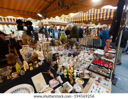 BARCELONA, SPAIN - FEBRUARY 20, 2014: People at flea market at square before Barcelona Cathedral