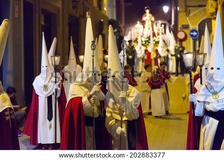MURCIA, SPAIN - APRIL 15, 2014: Evening procession during Holy Week in Murcia. Semana Santa  is Christian  processions at  Spanish cities and town