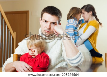 Young family conflict. Upset  man against sadness woman  at home