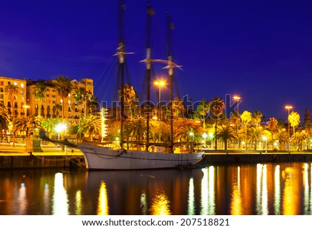 Night shot of yacht lying at Port Vell. Barcelona, Spain