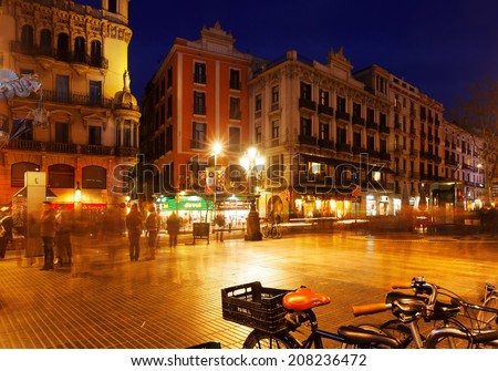 BARCELONA, SPAIN - MARCH 13, 2014: Night view of Rambla in Barcelona. La Rambla is street in central Barcelona