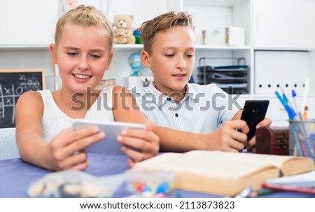 Similar – Image, Stock Photo Children playing with their toys on a wooden floor