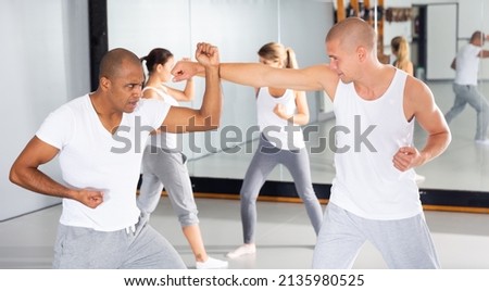 Similar – Image, Stock Photo unarmed close combat since the beginning