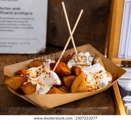 Similar – Image, Stock Photo Patatas bravas traditional Spanish potatoes snack tapas