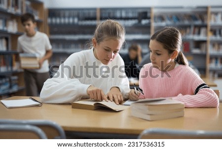 Similar – Image, Stock Photo Two teenager girls taking a selfie.