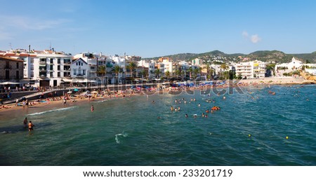 SITGES, SPAIN - AUGUST 6: Summer view of Sitges coast in August 6, 2013 in Sitges, Spain.  It is known for its sandy beach