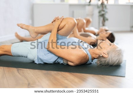 Similar – Image, Stock Photo Flexible woman doing yoga on paddleboard