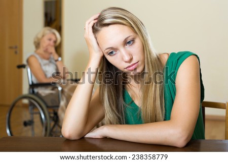 Communication problems between woman in wheelchair and female daughter