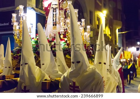 MURCIA, SPAIN - APRIL 15, 2014: Evening procession during Holy Week in Murcia. Semana Santa   is Christian  processions on  streets of Spanish cities