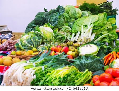 Fresh fruits and vegetables on  market counter