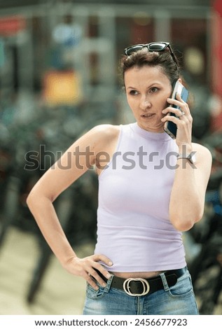 Similar – Image, Stock Photo Woman with bicycle seeks way on smartphone