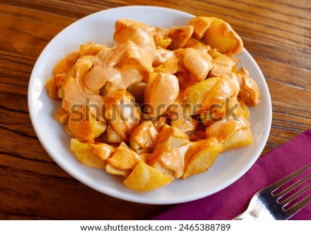 Similar – Image, Stock Photo Patatas bravas traditional Spanish potatoes snack tapas