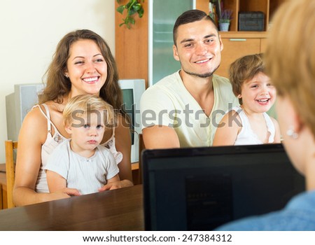 Parents and two daughters sitting in front of social worker