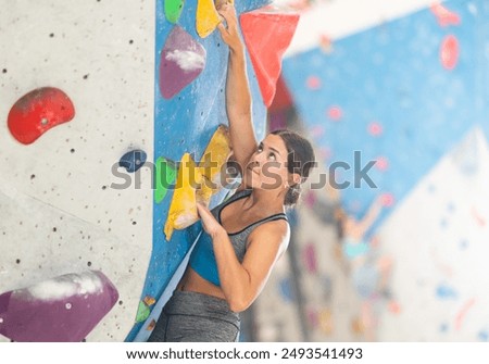 Similar – Image, Stock Photo Woman in a rock facing the sea doing a variation of handstand yoga pose