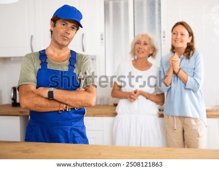 Similar – Image, Stock Photo Aged repairman in professional workshop with tools