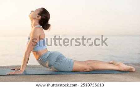 Similar – Image, Stock Photo Sportive woman performing yoga pose in room