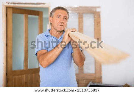 Similar – Image, Stock Photo Aged repairman in professional workshop with tools