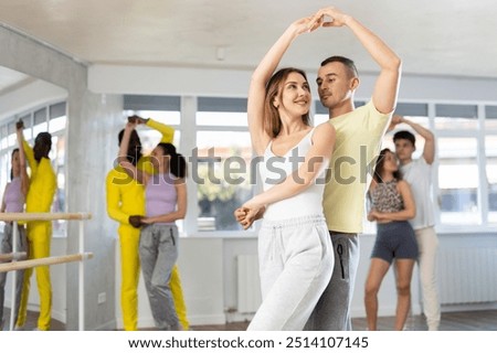 Similar – Image, Stock Photo Graceful woman dancing in dark park