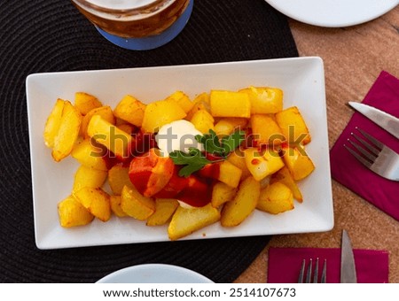 Similar – Image, Stock Photo Patatas bravas traditional Spanish potatoes snack tapas