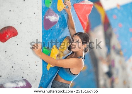 Similar – Image, Stock Photo Woman in a rock facing the sea doing a variation of handstand yoga pose