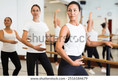 Similar – Image, Stock Photo Graceful woman dancing near wall in street